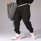 Mens Casual Pants with stylish pockets and comfortable fit, showcased with matching jacket and sporty sneakers.