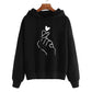 Fleece Hoodie with heart print design, showcasing a hand gesture on a black background for trendy casual wear.