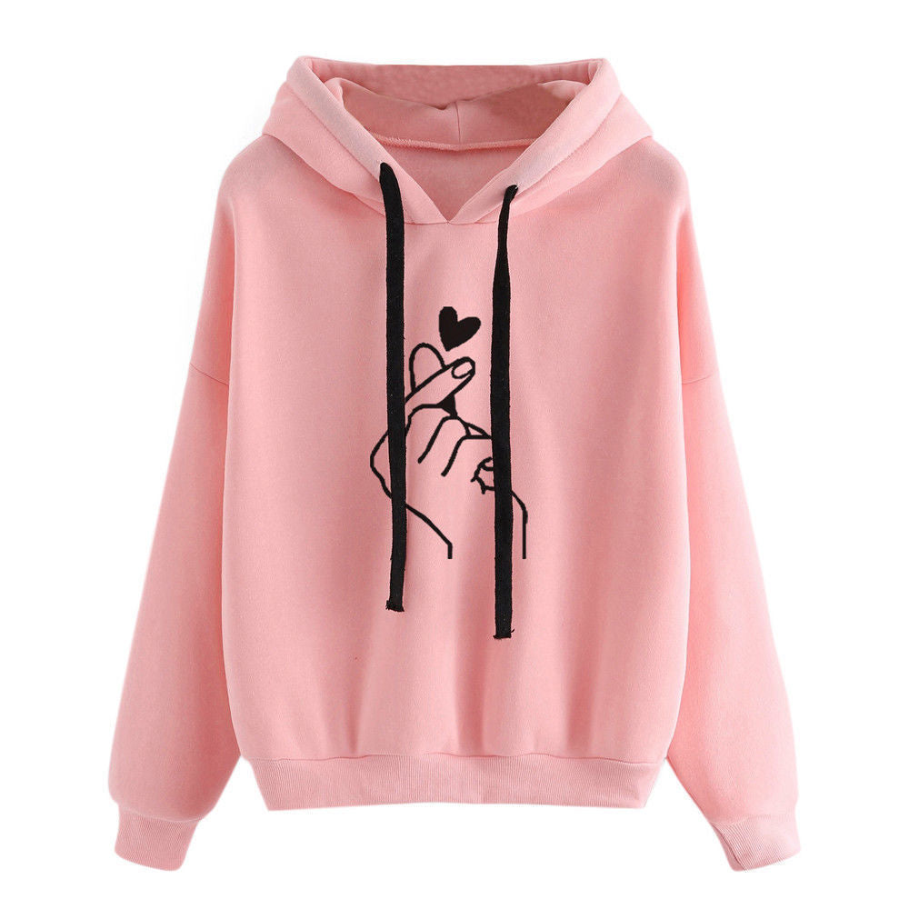 Fleece Hoodie with heart print design and stylish finger graphic in a soft pink color.