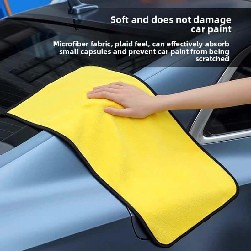 Car wash towel on a car surface, showcasing its softness and ability to protect car paint while drying.