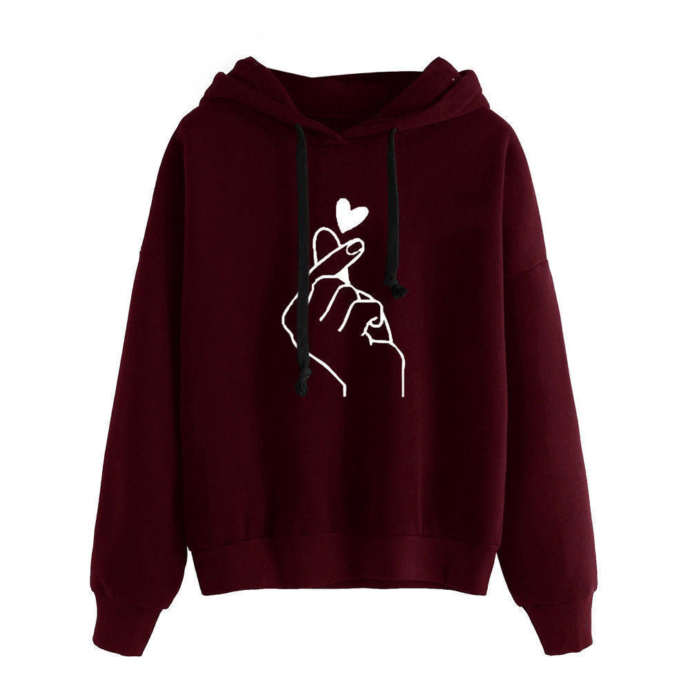 Fleece Hoodie featuring heart print design on a burgundy background with a comfortable fleece lining.