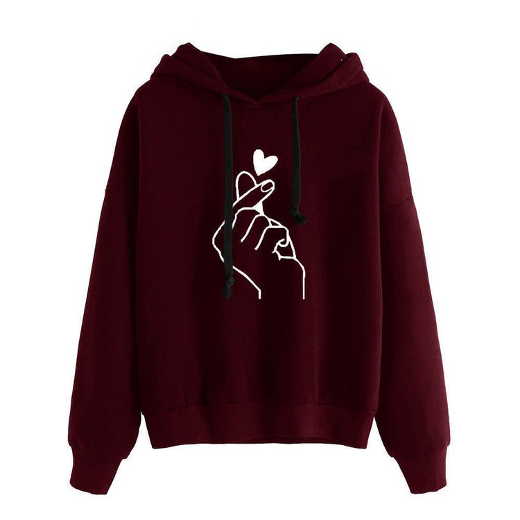 Fleece Hoodie featuring heart print design on a burgundy background with a comfortable fleece lining.