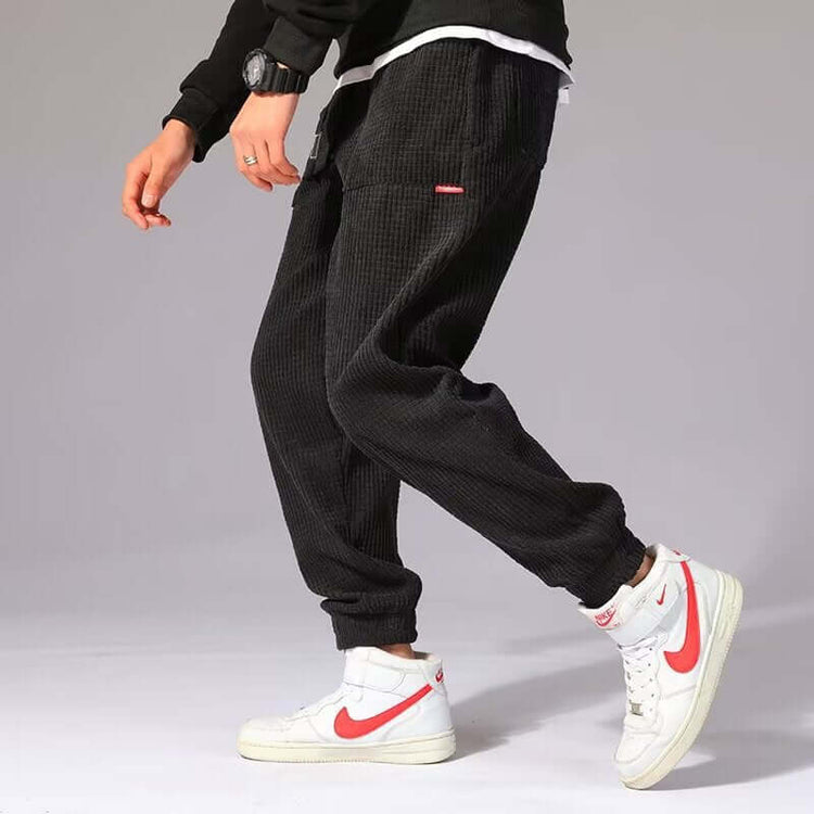 Mens Casual Pants worn with white Nike sneakers, showcasing a stylish and comfortable outfit for everyday wear.