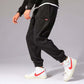 Mens Casual Pants worn with white Nike sneakers, showcasing a stylish and comfortable outfit for everyday wear.