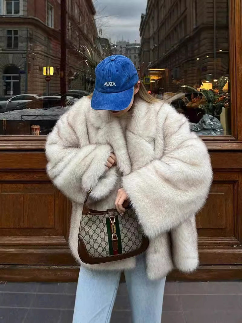 Fluffy Fox Fur Coat Women Loose Elegant Winter worn with a blue cap and a designer handbag in an urban setting.